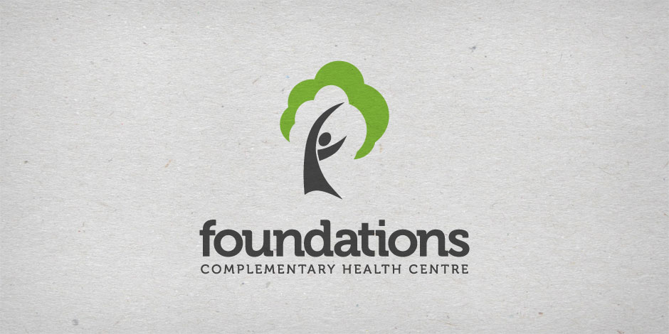 Logo of "Foundations Complementary Health Centre" with a stylized tree design where the trunk is a person raising their arms, surrounded by a green canopy.